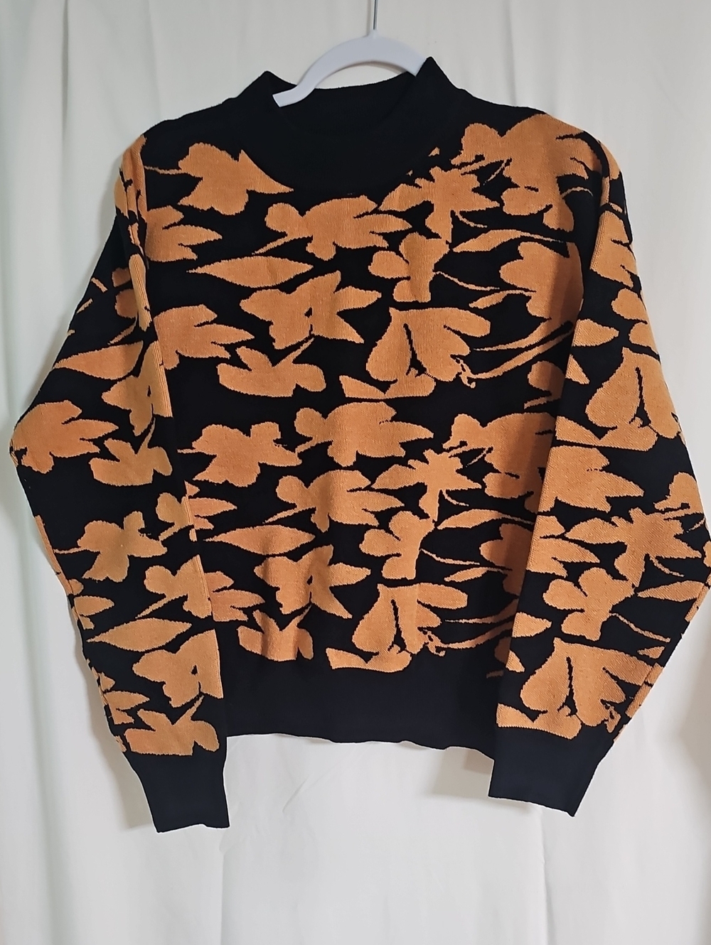 Merci Black Sweater with Tan Floral Pattern